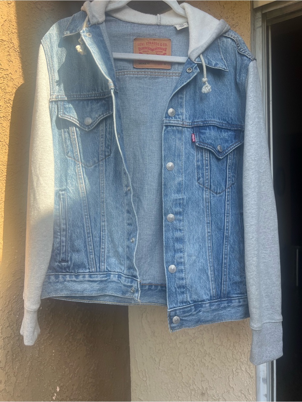 Levi's Blue Denim Trucker Jacket with Gray Hoodie Sleeves